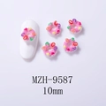 Detailed view of pink resin donut nail charms with LOVE lettering and star patterns - Pink Heart Star Donut MZH-9587