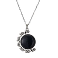 Macro shot of silver moon pendant featuring a deep blue star stone and sparkling crystals - Dark Blue Starry/Metal Chain