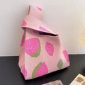 Pink knitted tote bag featuring a strawberry pattern and a unique knot handle design - Pink Green Strawberry - Pink