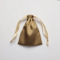 Golden satin drawstring pouch with beige ribbon, elegant silk texture gift storage bag - Bronze Gold