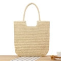 Handwoven straw tote bag in natural beige with sturdy handles for summer beach casual style - Beige