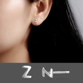 Minimalist S925 sterling silver Z-shaped stud earring shown on model and in macro detail - Letter Z/Pair