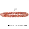 Detail view of 6mm red agate beads and 19cm elastic string for crystal bracelet - Angelite Faux Sunstone