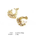 Detailed view of two gold crescent moon charms with micro-pave cubic zirconia stones - 10-Moon Star