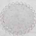 Macro view of 6mm white frosted glass beads displayed in a decorative glass tray - 4mm / White