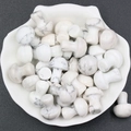2cm mini mushroom-shaped natural white marble stones scattered in a decorative white dish - Howlite