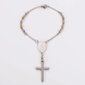 Detailed view of silver and gold rosary beads with Virgin Mary medal and cross pendant - Gold & Silver