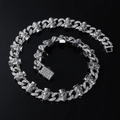 Macro detail of silver Cuban chain with diamond skull links and iced-out rectangle clasp - Necklace (45cm) / Silver