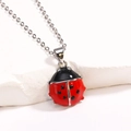 Silver ladybug necklace with red enamel beetle pendant on white stone display - Style 3 Platinum 15mm