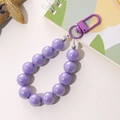 Macro detail of vibrant purple aurora acrylic beads for keychain and bag decoration - Mermaid Iridescent Bead Charm / Purple