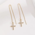 Elegant gold plated copper cross threader earrings with cubic zirconia stones on white background - Cross Micro-set Ear Thread