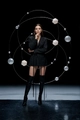 Detail of dark avant-garde blazer dress with long waist straps and black high leather boots - S / Black
