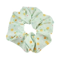 Dettaglio di un elastico per capelli in organza verde chiaro con piccoli fiori colorati - Fiori Verdi