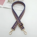 Close-up of adjustable chevron jacquard strap with gold metal hooks on white surface - Beige Brown Blue + Gold Hook