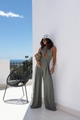 Olive green halter neck wide leg jumpsuit with waist cut-outs in a luxury resort setting - S / Grey Green