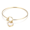 Golden heart charm bracelet with white enamel pendant and sleek round clasp detail - Gold White Heart Bracelet (KB165588-Z)