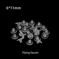 Macro shot of clear silicone flying saucer earring backings sized 6x11mm on black background - 6mm Flying Saucer