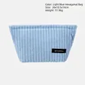 Light blue corduroy makeup bag with striped texture and top zipper closure - Blue Hexagonal Bag