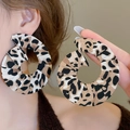 Detail of large leopard print fabric wrapped hoop earring shown on a model's ear - 41# 925 Sterling Silver Earring Post - Brown - Fabric Round