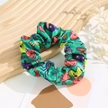 Detail of green silk scrunchie with festive Halloween prints including pumpkins and ghosts - Halloween #2 (Green Pumpkin Ghost)