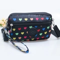 Women's black nylon crossbody bag with colorful heart patterns and sport logo - Black with Colorful Hearts