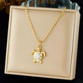 Detailed close-up of a golden sea turtle pendant with white inlay on a velvet display - Sea Turtle with Shell Material Style (N3562)