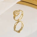 Golden Tree of Life stainless steel ring with crystal accents on a reflective surface - Gold (Tree of Life Style 2)