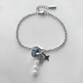 Bracelet élégant en acier inoxydable argenté avec perles blanches et strass bleus - 15+3cm / Acier