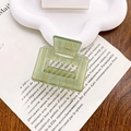Small square acetate hair claw clip with vintage green stripes on a white tray - Water Ripple Green
