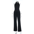 Detail eines schwarzen Zweiteilers mit Neckholder-Oberteil und Hose mit weitem Bein - S / Schwarz