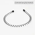 Macro detail of black metal spring headband with protective round tips and wave design - Spring Style 1pc