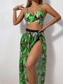 Detail of tropical leaf print bikini set and semi-transparent side slit beach skirt - Green