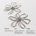 Abstract silver hollow flower earrings with metal wire wrapped floral design in brass - White Gold