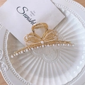 Golden metal hair claw clip with bow design and white pearls for women's hairstyling - Pearl Bowknot