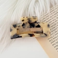Rectangle amber tortoise shell acetate hair claw clip on soft white faux fur background - Rectangular Hollow Out / Light Tortoise Shell