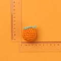 Handmade crochet orange keychain charm in bright yarn, measuring 3.5cm by 3.5cm size - Orange Little Tangerine Doll