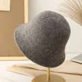 Deep grey knitted cloche bucket hat for women on a gold stand with cozy desk decor - Light Gray