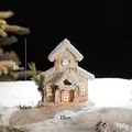 Illuminated wooden Christmas cabin with warm LED lights and snowy details, 18cm height - Snow Top Cabin Style A Battery Model
