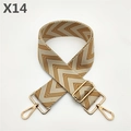 Detail of wide woven strap with geometric herringbone pattern and golden metal buckles - Tan