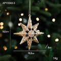 Stella di Natale ottagonale dorata con trama 3D a rilievo appesa a un albero di Natale - Stella Esplosiva