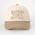 Close-up of embroidered 'BAD DAY TO BE A HOT DOG' text on contrast color baseball cap - Off-White/Dark Khaki
