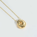 Minimalist gold balloon letter pendant necklace with a polished irregular organic shape - Letter O