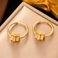 Detail of gold geometric hoop earrings with tiered cube pendants on a jewelry display box - [G3105] Gold Ladder Cube Pendant Earrings