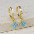 Close-up of S925 sterling silver stamp on golden hoop earring with blue flower petal charm - Gold-Blue Zirconia