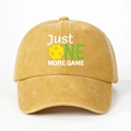 Detailed view of yellow Pickleball hat featuring Just ONE MORE GAME print and washed texture - Yellow