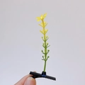 Creative yellow sprout hair clip with black duckbill base held in hand - Rice Ear