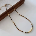 Tiger eye beaded necklace with green stone and pearl accents on a wooden display tray - Tiger Eye Necklace XL0361