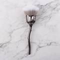 Rose shaped nail dust brush with metallic handle and gradient bristles on marble - Grey Silver Rose