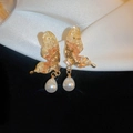Detail of golden butterfly earrings with amber resin wings and a teardrop pearl drop - Contrast Color Crystal Butterfly Studs (8#银针)