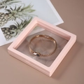 Pink floating jewelry display box with clear PE film holding a rose gold chain bracelet - 9x9cm / Smoke Pink